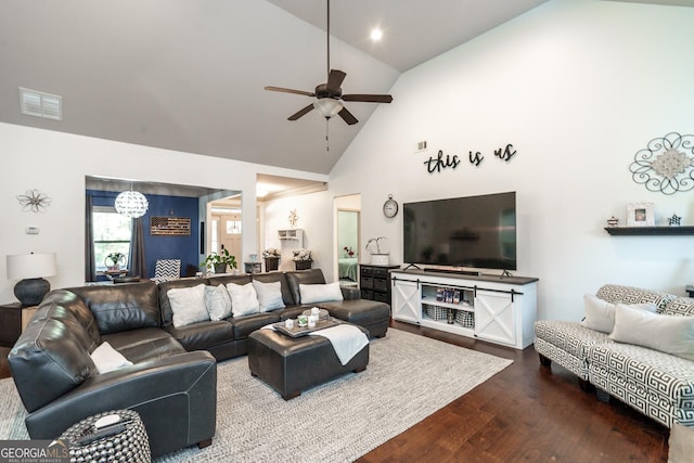 living room with ceiling fan, high vaulted ceiling, and wood-type flooring