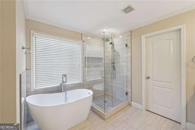 bathroom with tile patterned flooring, plus walk in shower, and ornamental molding