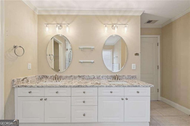 bathroom featuring vanity, tile patterned flooring, and ornamental molding