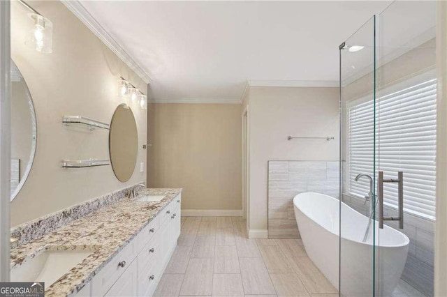 bathroom with a tub to relax in, crown molding, tile patterned floors, vanity, and tile walls