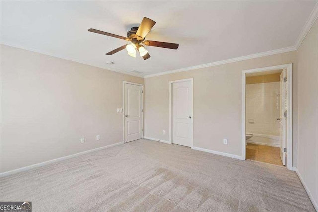 unfurnished bedroom with connected bathroom, light carpet, ceiling fan, and crown molding