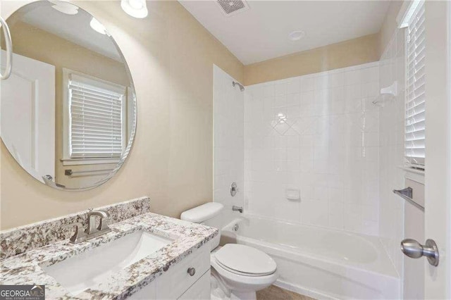 full bathroom featuring bathing tub / shower combination, vanity, and toilet