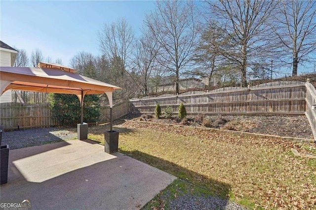 view of yard featuring a gazebo and a patio area