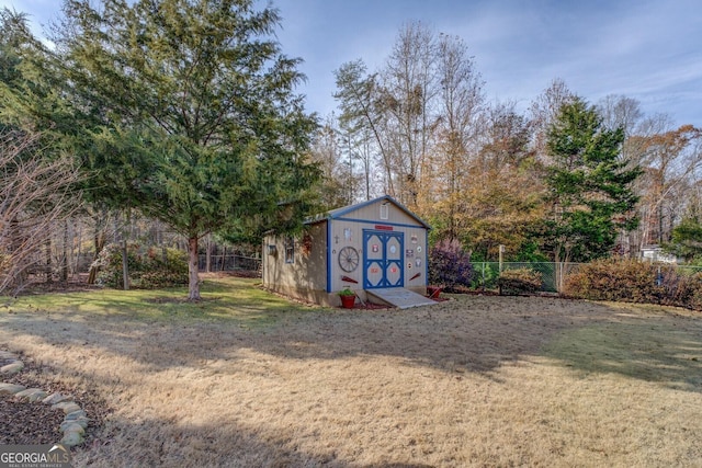 view of outbuilding with a lawn