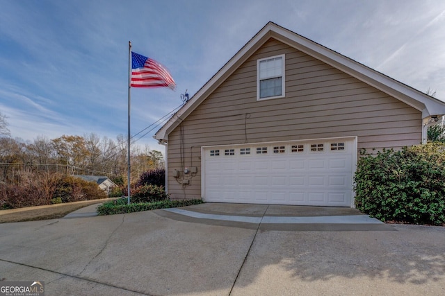 view of property exterior with a garage