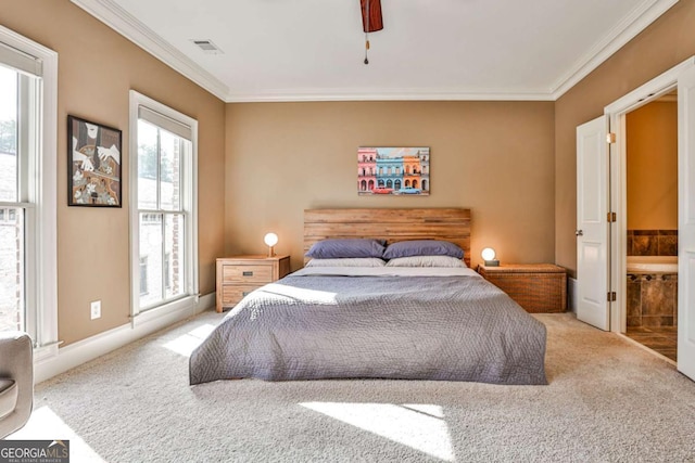 carpeted bedroom featuring ornamental molding, ceiling fan, and connected bathroom