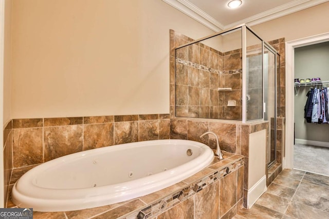 bathroom featuring ornamental molding and separate shower and tub