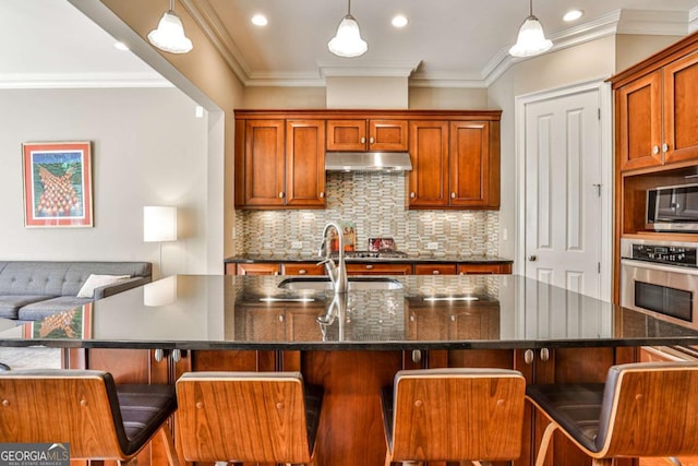 kitchen featuring a center island with sink and appliances with stainless steel finishes