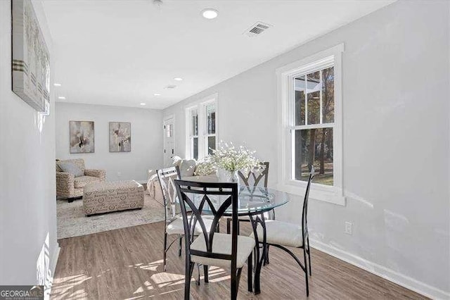 dining area with hardwood / wood-style flooring