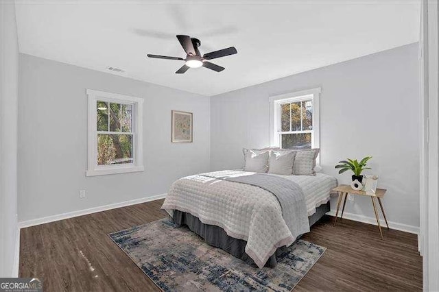 bedroom featuring ceiling fan and dark hardwood / wood-style floors