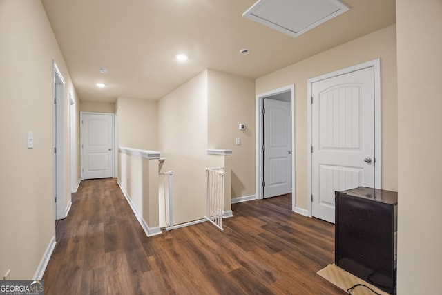 corridor featuring dark hardwood / wood-style flooring