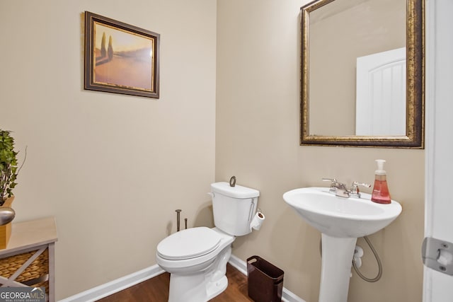 bathroom featuring toilet and hardwood / wood-style floors