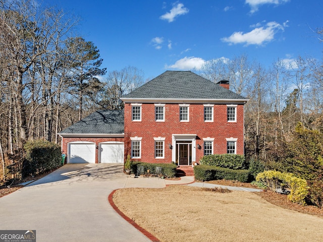 colonial home with a garage