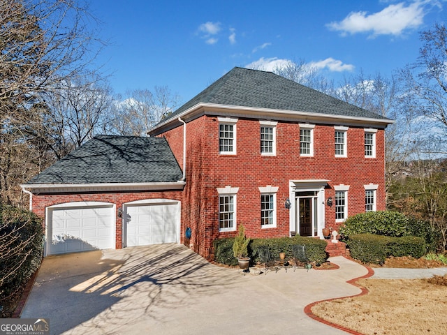 colonial house featuring a garage