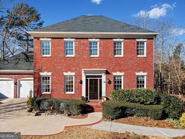 colonial home with a garage