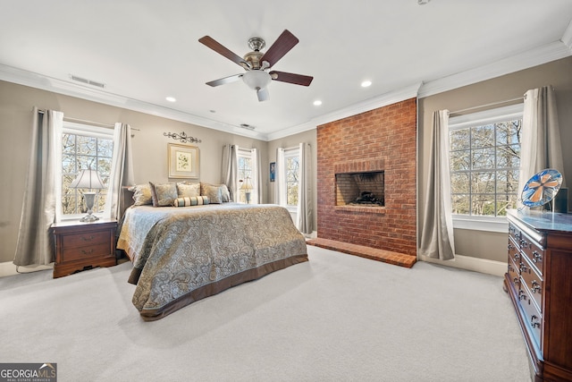 bedroom with ornamental molding, light colored carpet, and ceiling fan