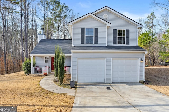 front of property with a porch and a garage