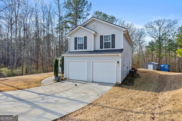 front facade with a porch and a garage