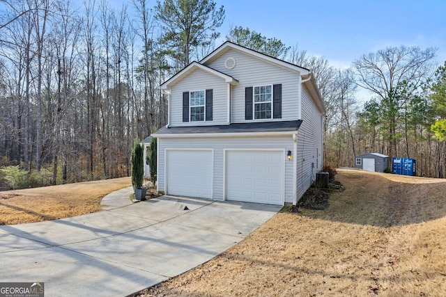 view of home's exterior featuring a garage and central AC