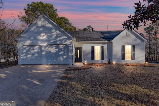 4100 Chanticleer Dr, Kennesaw, GA 30152 - view of front of house with concrete driveway, a garage, and a shingled roof