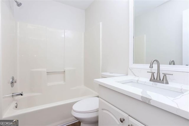 full bathroom with toilet, vanity, and shower / bath combination