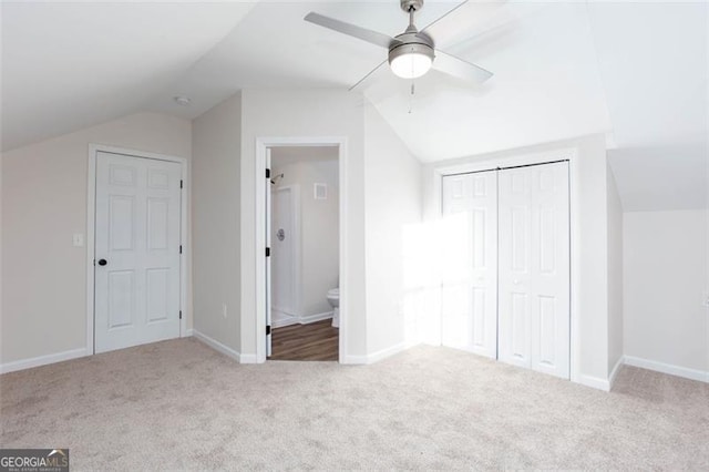 bonus room featuring ceiling fan, light colored carpet, and lofted ceiling