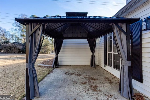 view of vehicle parking with a gazebo