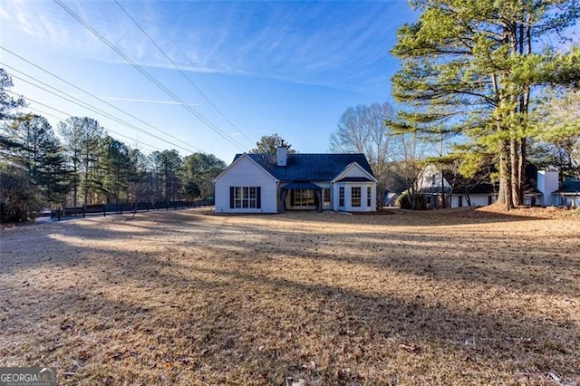 ranch-style home with a front lawn