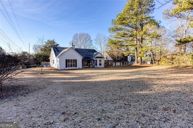 4100 Chanticleer Dr, Kennesaw, GA 30152 - view of side of home with a chimney
