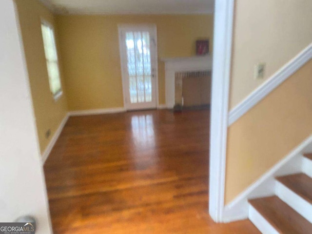 stairs with hardwood / wood-style flooring