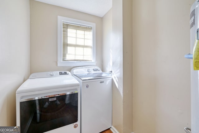 clothes washing area featuring laundry area and independent washer and dryer