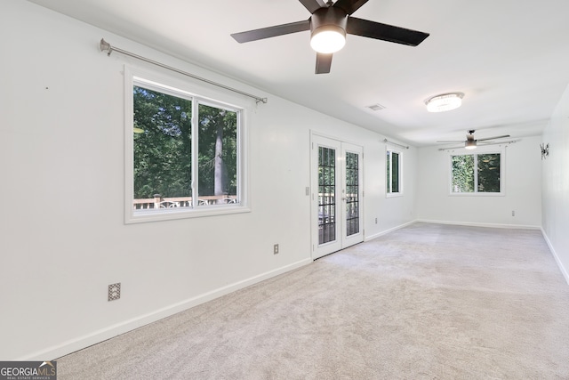 unfurnished room featuring ceiling fan, french doors, carpet, baseboards, and visible vents