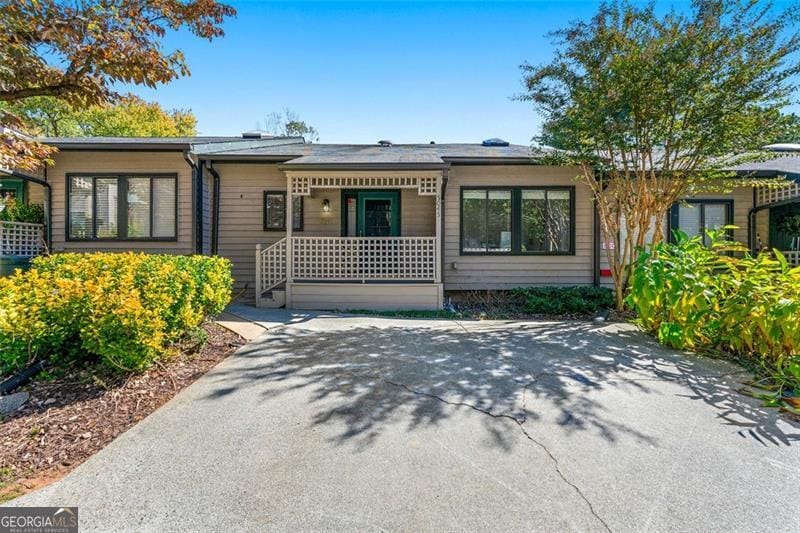 single story home featuring covered porch