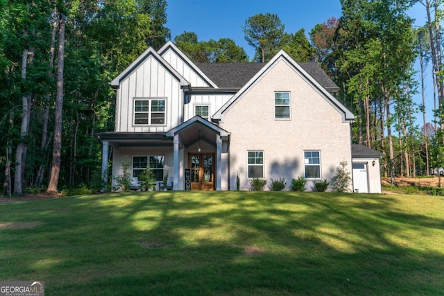 view of front facade with french doors and a front yard