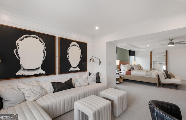 bedroom featuring ceiling fan, crown molding, and carpet floors