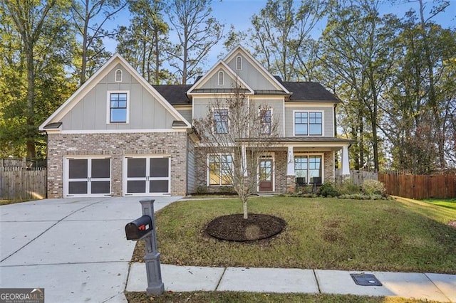 craftsman-style house featuring a garage, a porch, and a front yard