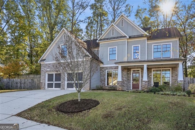 craftsman-style home featuring a porch and a front lawn