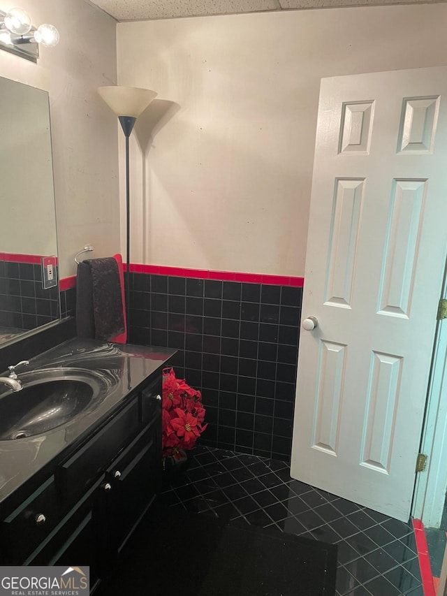 bathroom with tile patterned flooring and vanity