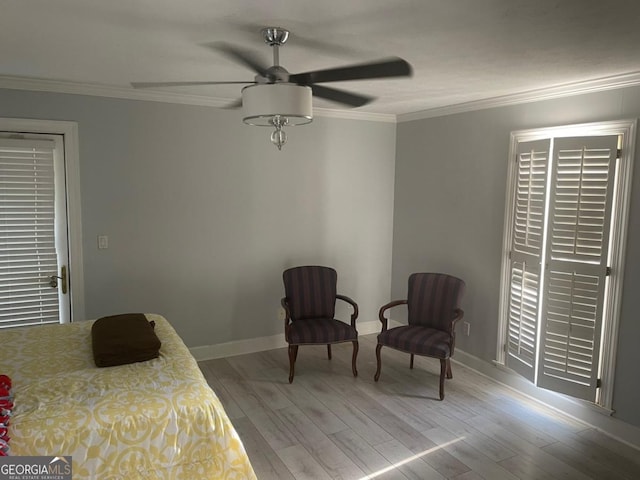 bedroom featuring ceiling fan, light wood-type flooring, and ornamental molding