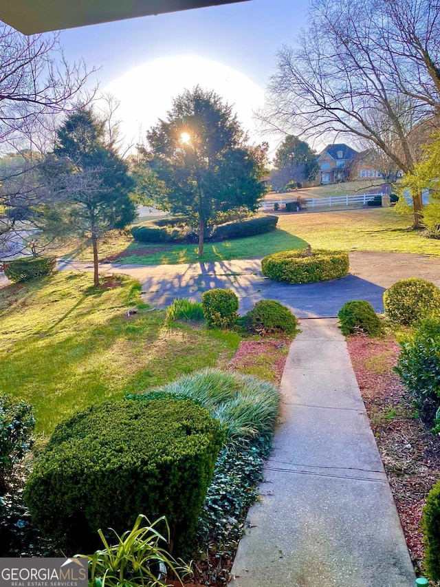 view of home's community with a lawn