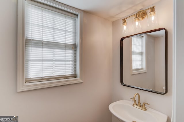 bathroom featuring plenty of natural light and a sink