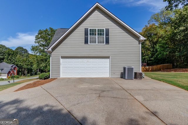 view of side of property with a garage