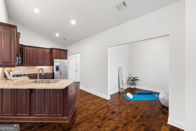 kitchen featuring dark hardwood / wood-style flooring, sink, decorative backsplash, and stainless steel refrigerator with ice dispenser