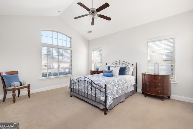 bedroom with lofted ceiling, light carpet, and ceiling fan