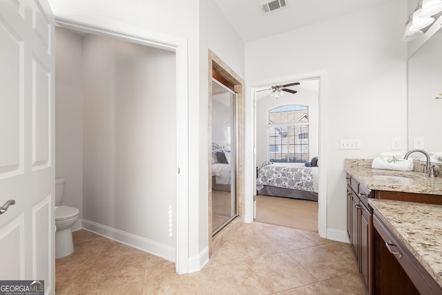 bathroom featuring vanity, ceiling fan, and toilet