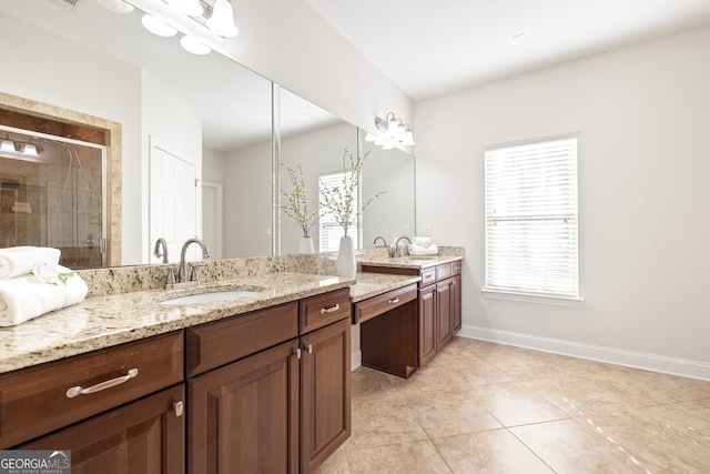 bathroom featuring walk in shower, tile patterned floors, and vanity