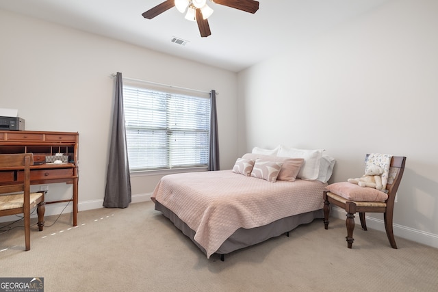 bedroom with light carpet and ceiling fan