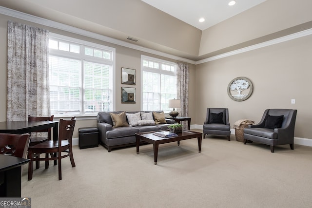 living room featuring ornamental molding and light colored carpet