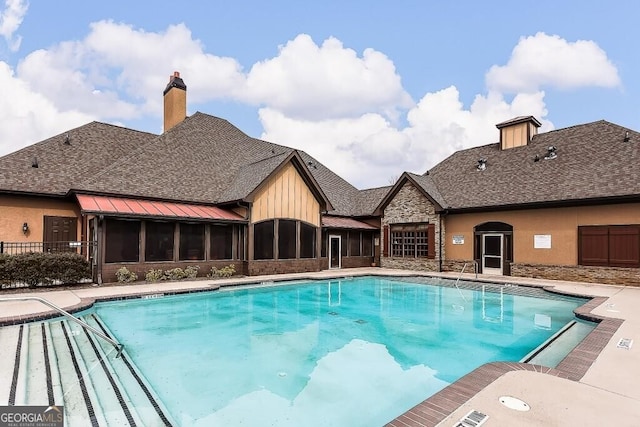 view of pool featuring a patio area