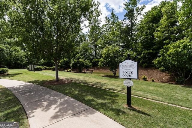 view of home's community featuring a yard